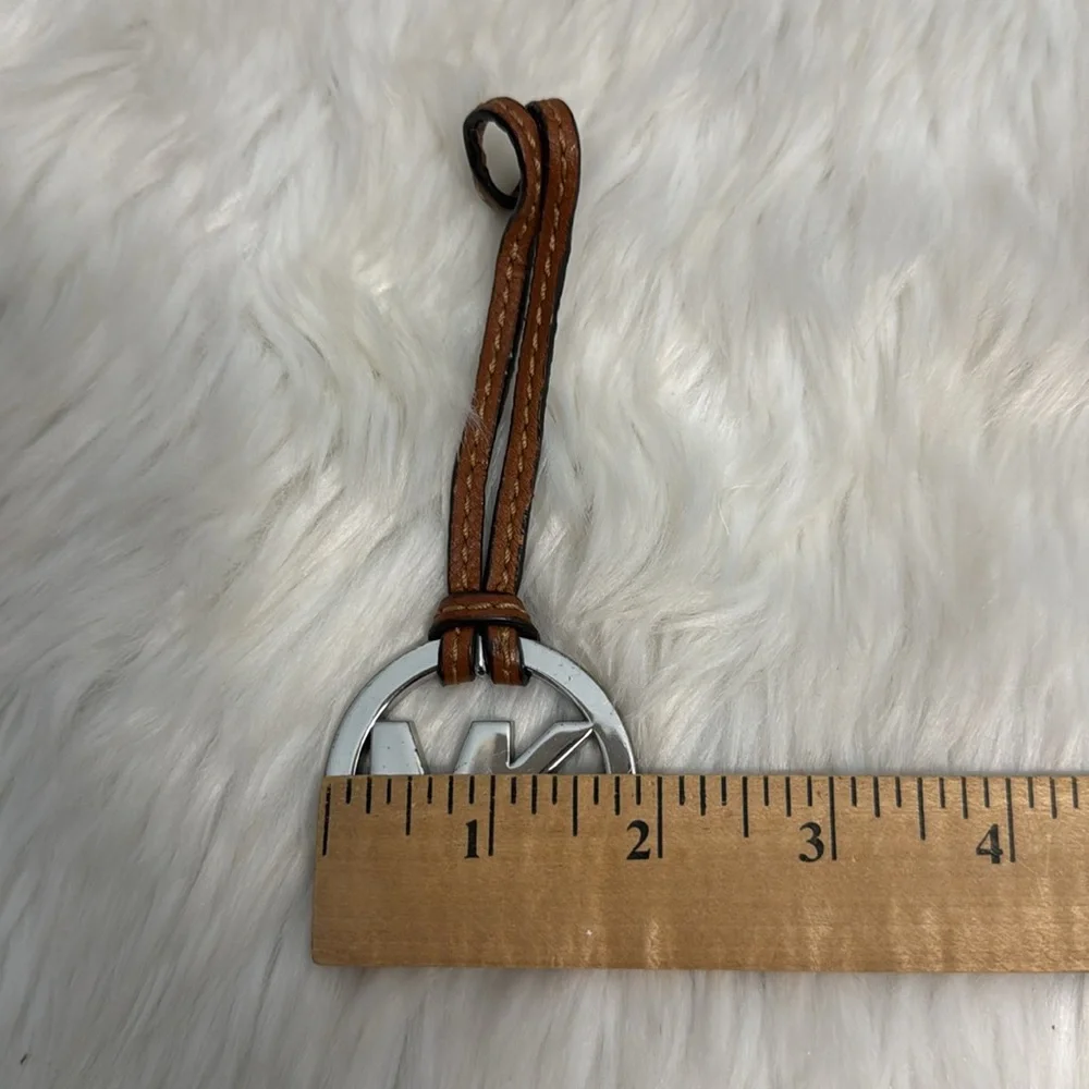 Michael Kors Fob Hang Tag Silver Color Metal Logo on Cognac Brown Leather Strap